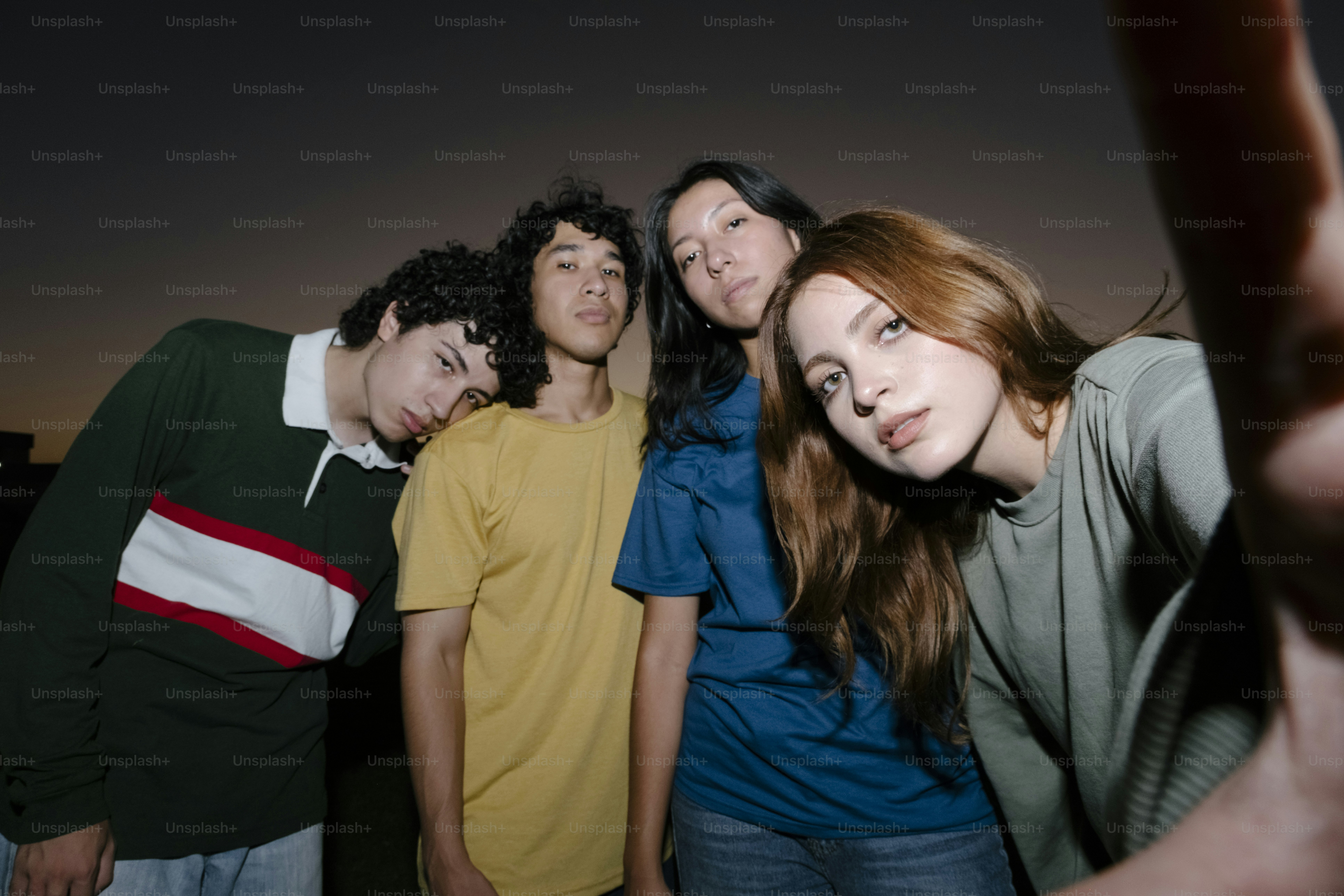 A group of young people standing next to each other